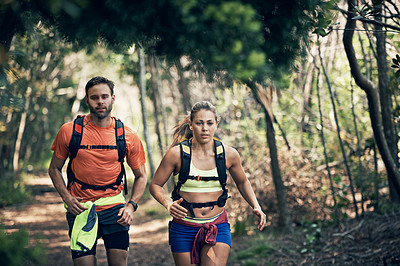 Buy stock photo Cropped shot of a young athletic couple out for their morning run