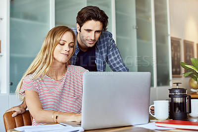 Buy stock photo Cropped shot of a young attractive couple planning their home budget together at home