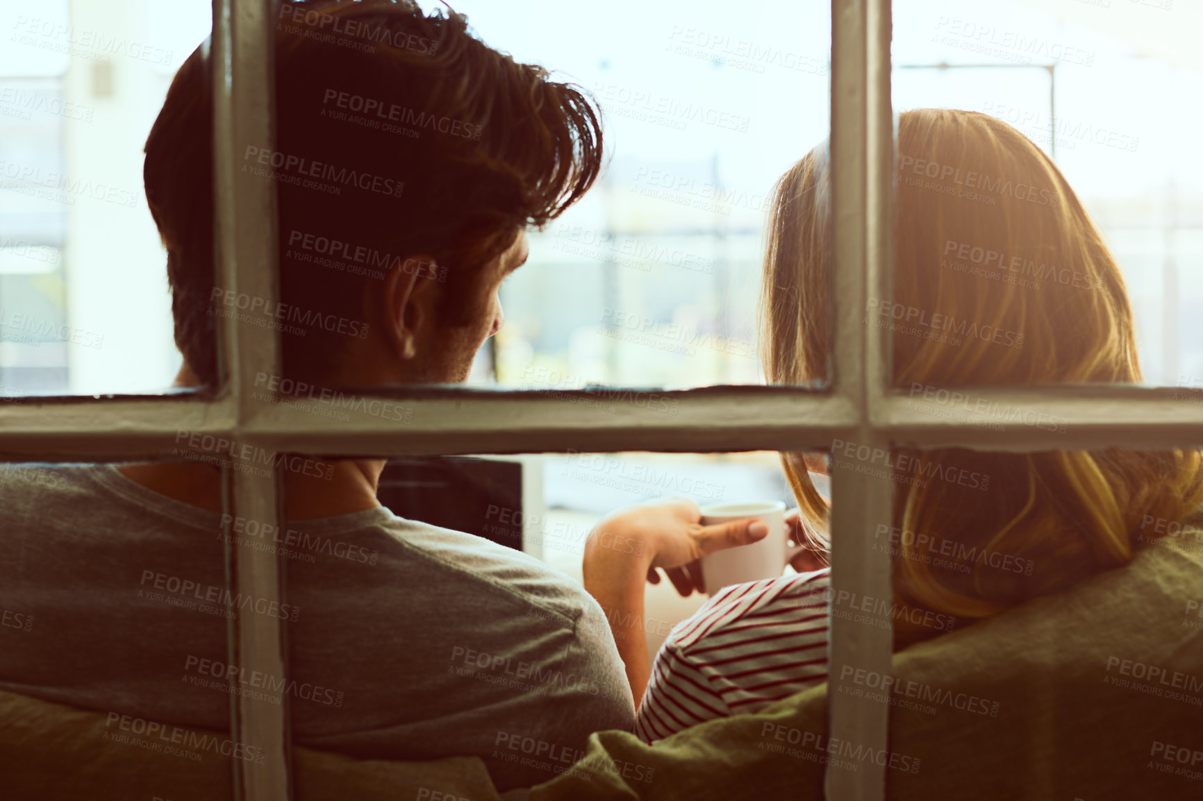 Buy stock photo Tablet, window and back of couple in home for connection, streaming service and bonding together. Love, online film subscription and coffee with man and woman with tech in house for relax and app