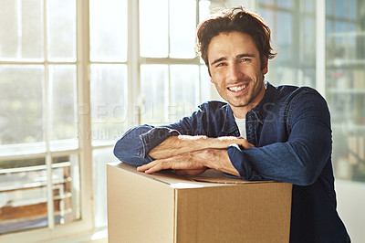 Buy stock photo Shot of a young man moving into his new home