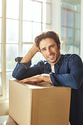 Buy stock photo Shot of a young man moving into his new home