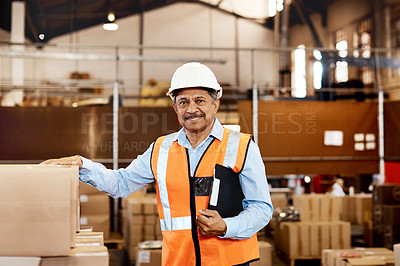 Buy stock photo Shot of a confident mature man working in a warehouse