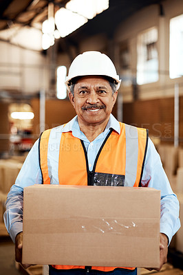 Buy stock photo Shot of a confident mature man working in a warehouse