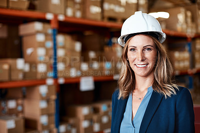 Buy stock photo Shot of a confident young woman working in a warehouse