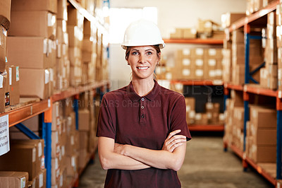 Buy stock photo Portrait of a young woman standing in a warehouse