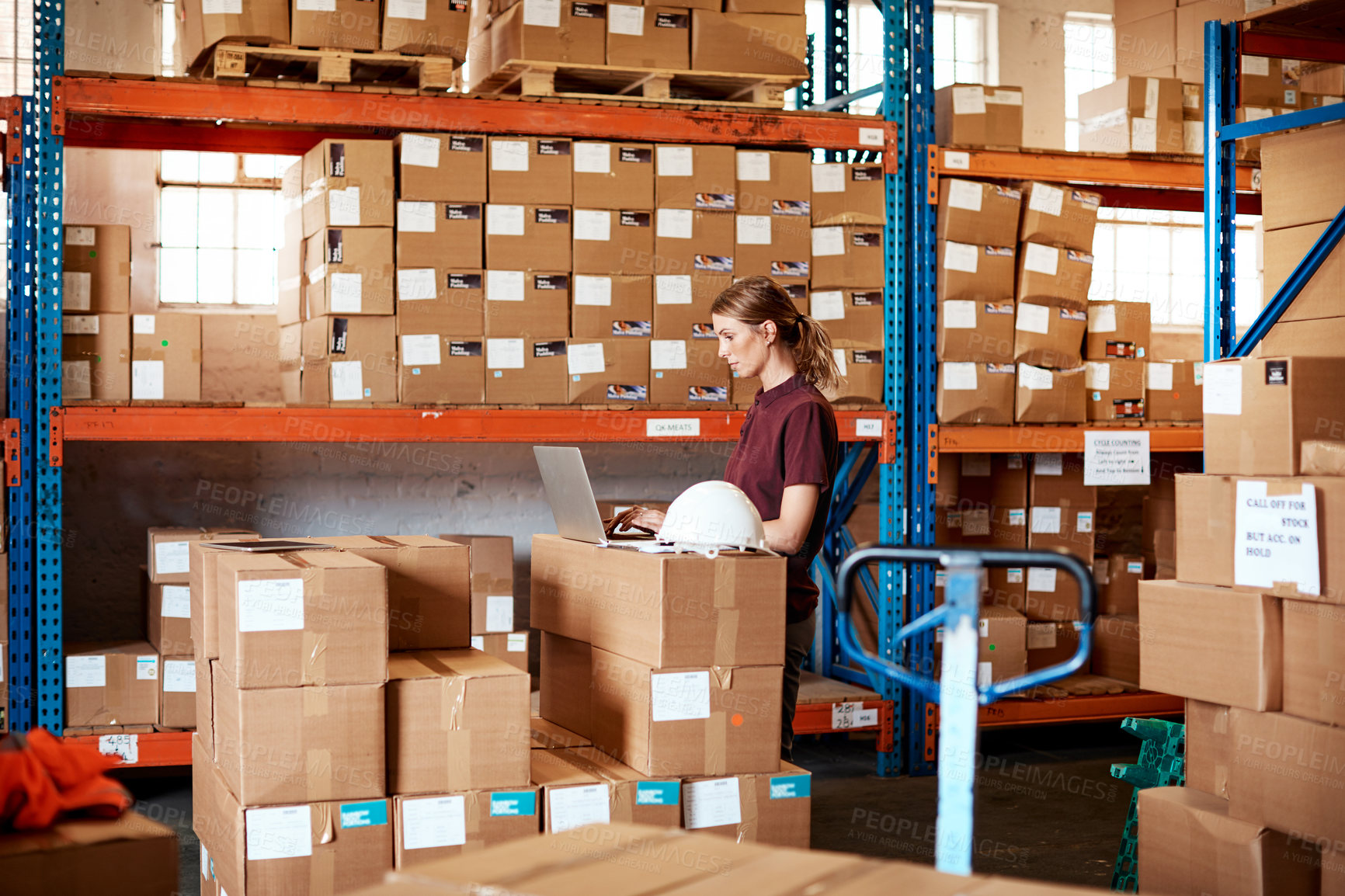 Buy stock photo Supervisor, woman and logistics in warehouse with laptop, process shipping bills and track delivery. Manager, person and typing in distribution center with computer, email and invoice from courier.