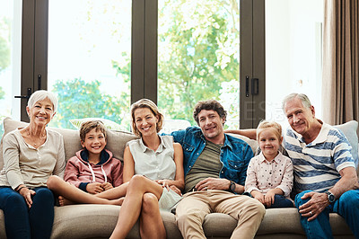 Buy stock photo Portrait of a happy family spending quality time together at home