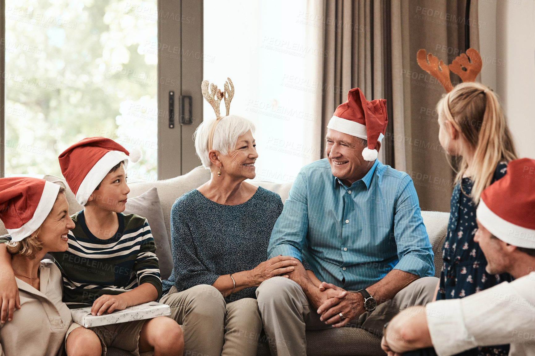 Buy stock photo Relax, big family and talk with laugh for christmas spirit, holiday celebration or bonding on sofa. Xmas, grandparents and parents with children for gift giving, festive season or generations in home