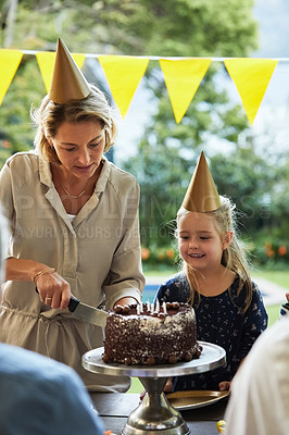 Buy stock photo Shot of a happy family celebrating a birthday at home in the garden