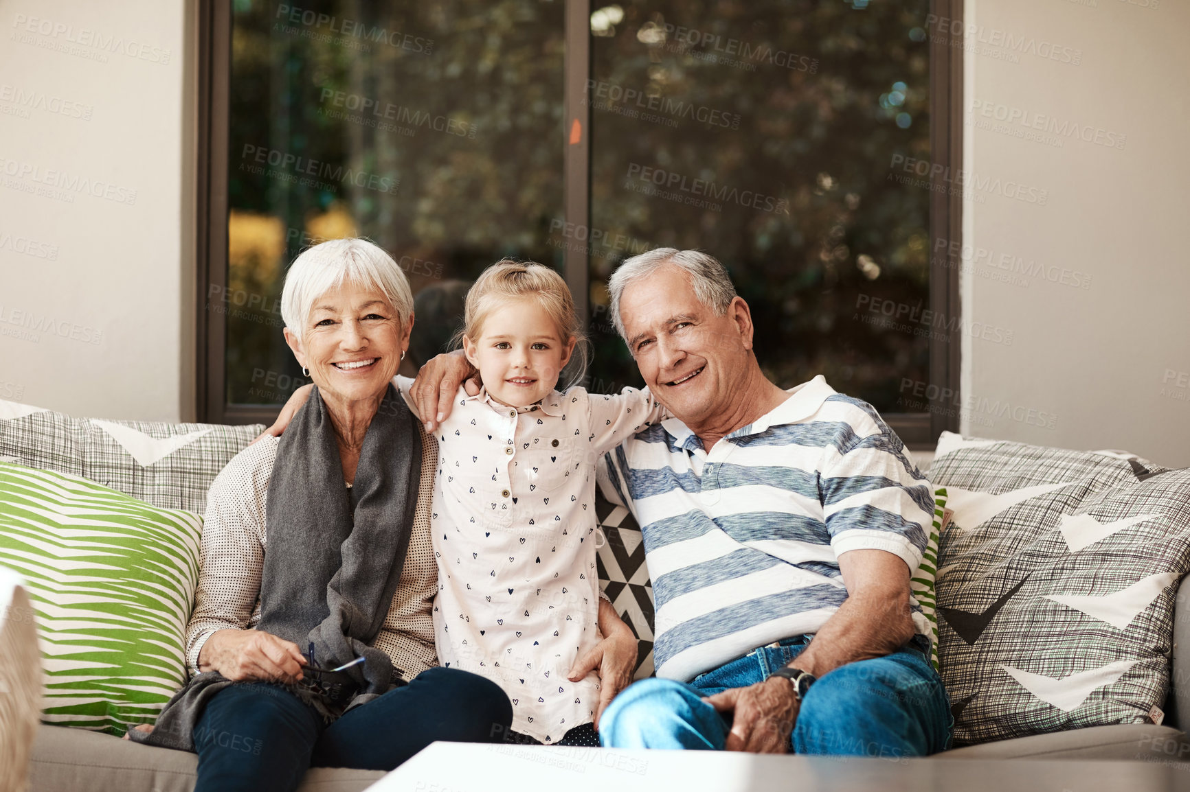Buy stock photo Grandparents, child and smile with portrait at house for babysitting, bonding together and love. Senior people, grandchild and hug on patio for holiday visit, connection and relationship development