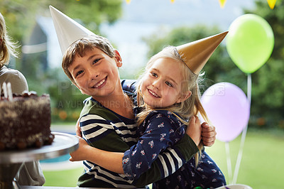 Buy stock photo Shot of a happy brother and sister celebrating a birthday at home in the garden