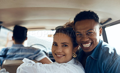 Buy stock photo Shot of a happy young couple going on a road trip with friends