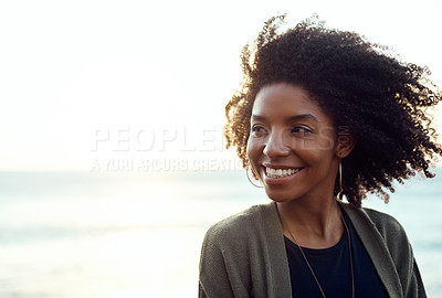 Buy stock photo Shot of an attractive young woman enjoying a vacation along the coast