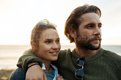 Buy stock photo hot of a happy young couple sharing a romantic moment on a vacation along the coast