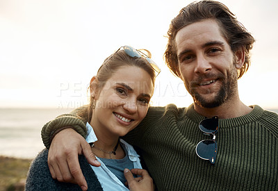Buy stock photo hot of a happy young couple sharing a romantic moment on a vacation along the coast