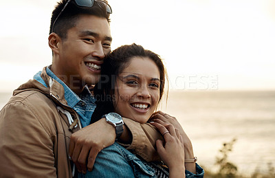 Buy stock photo hot of a happy young couple sharing a romantic moment on a vacation along the coast