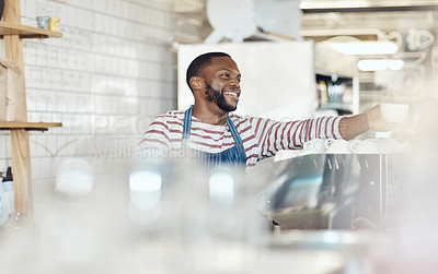 Buy stock photo Cropped shot of a young barista serving coffee in a cafe