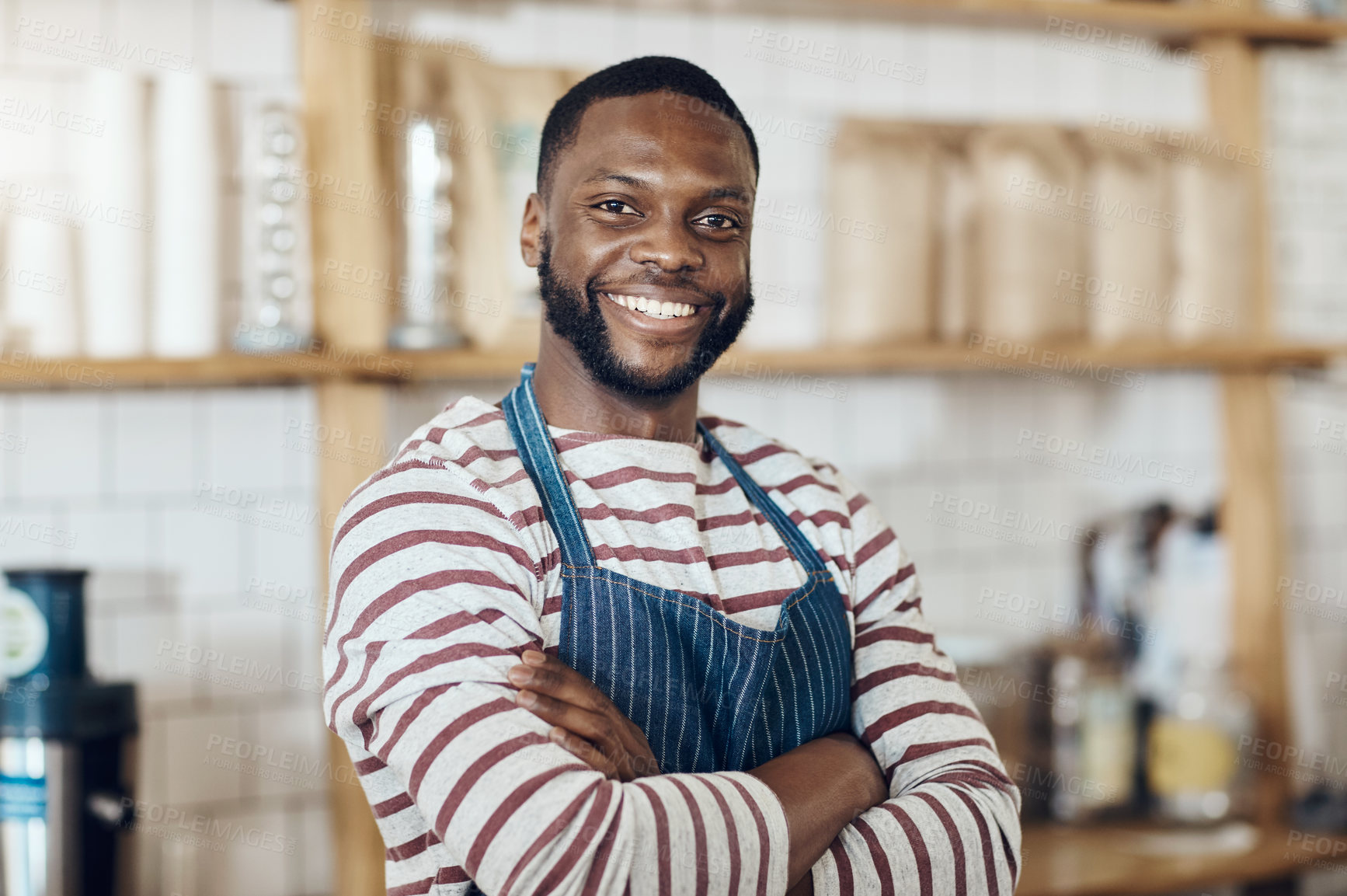 Buy stock photo Cropped shot of a young shop owner standing in his cafe