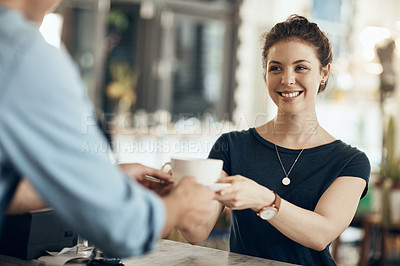 Buy stock photo Cropped shot of a young woman being served in a coffee shop