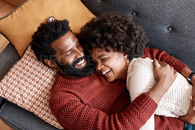 Buy stock photo Cropped shot of an affectionate couple relaxing on the sofa at home