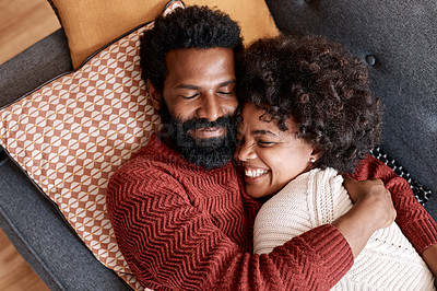 Buy stock photo Cropped shot of an affectionate couple relaxing on the sofa at home