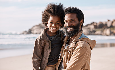 Buy stock photo Shot of an adorable little boy having a fun day at the beach with his father