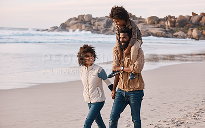 Buy stock photo Shot of a happy young family going for a walk along the beach