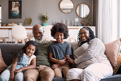 Buy stock photo Portrait of two adorable young siblings bonding and spending time with their grandparents at home