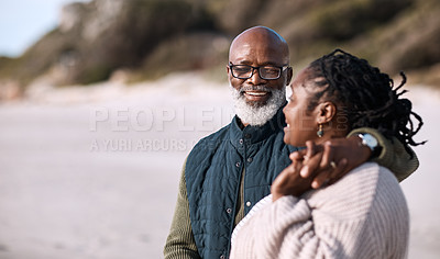 Buy stock photo Shot of a happy mature couple spending a romantic day at the beach