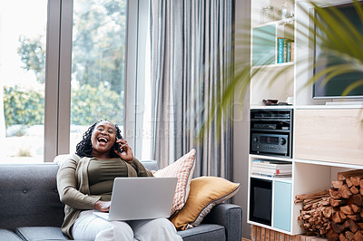 Buy stock photo Shot of a mature woman talking on a cellphone while using a laptop at home