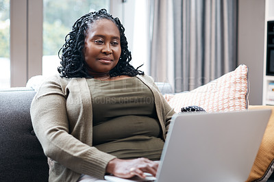Buy stock photo Shot of a mature woman using a laptop at home