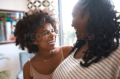 Buy stock photo Shot of a happy young woman bonding and spending time with her mother at home