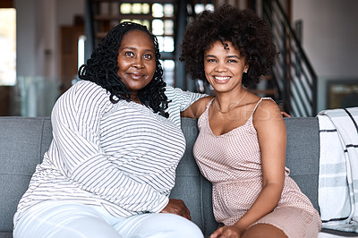 Buy stock photo Portrait of a happy young woman bonding and spending time with her mother at home