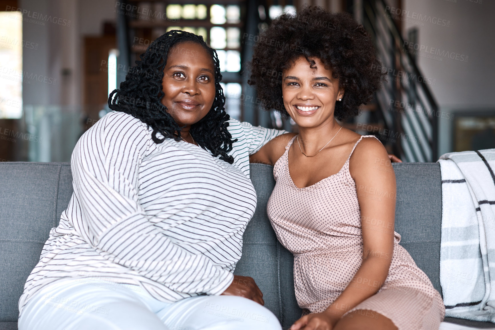 Buy stock photo Portrait of a happy young woman bonding and spending time with her mother at home