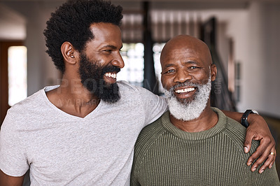 Buy stock photo Portrait of a happy senior man bonding and spending time with his adult son at home