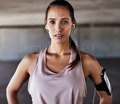 Buy stock photo Cropped portrait of an attractive young female athlete working out in the city