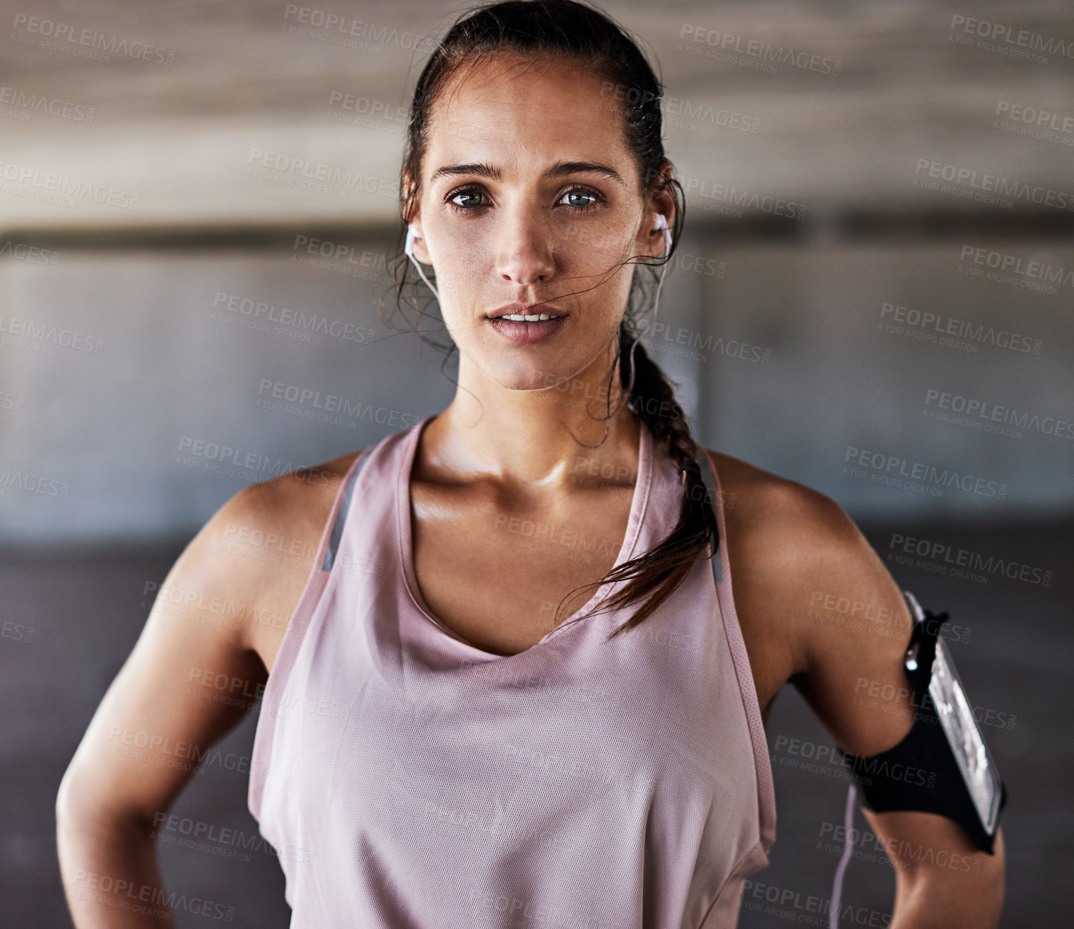 Buy stock photo Outdoor, athlete and woman with earphones, fitness and listening to music after exercise and break. Serious, runner and person with tech post workout, portrait and streaming song with subscription