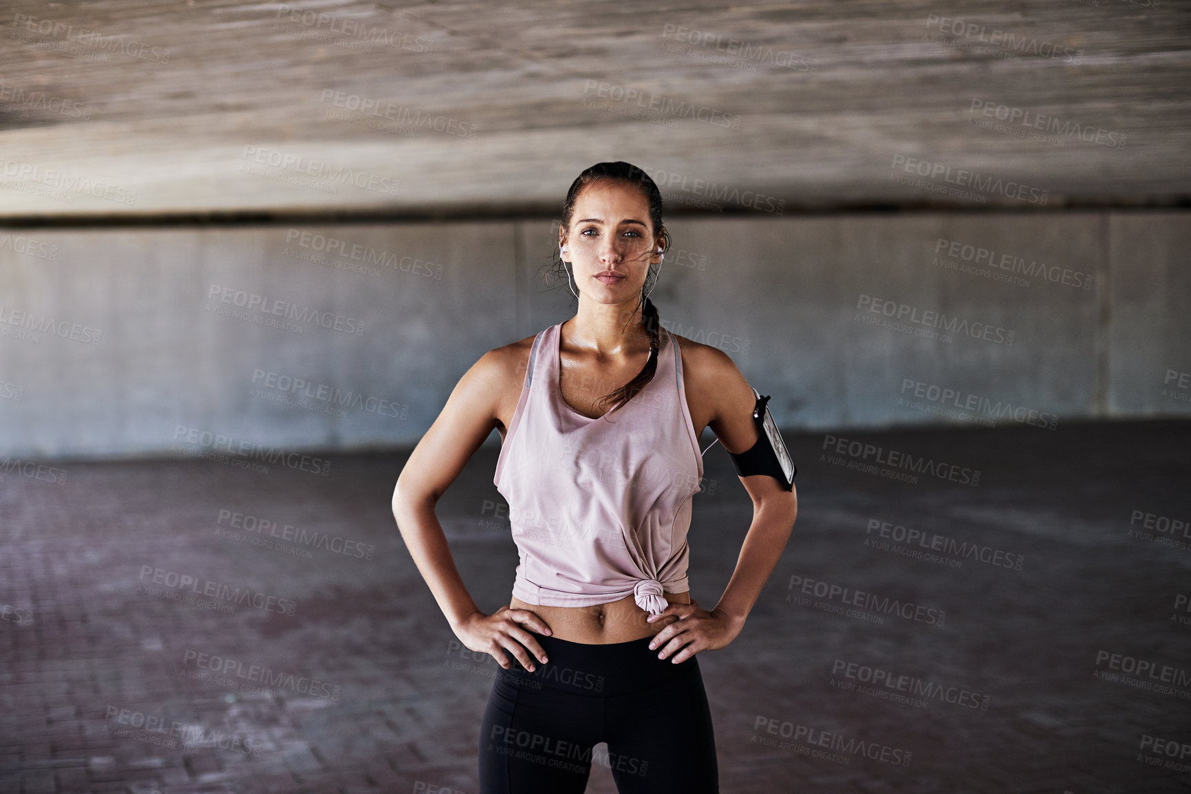 Buy stock photo Earphones, fitness and portrait of woman in city with space for cardio or health under bridge. Exercise, music and workout with confident runner in urban town for physical activity or training