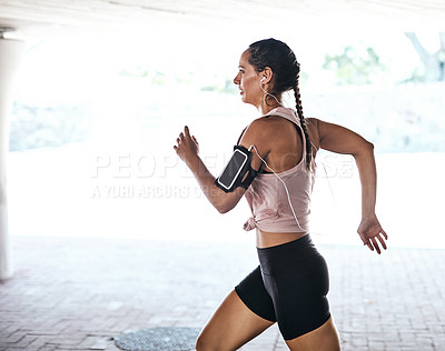 Buy stock photo Cropped shot of an attractive young female athlete working out in the city