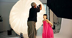 Photographer, model and fashion photoshoot on studio with camera, trendy clothes and magazine campaign. People, cameraman and photography on set with gear, stylish outfit and creative media project.