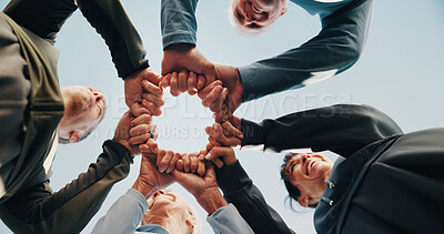 Buy stock photo Blue sky, people and hands with fist bump for fitness, support and celebration together. Nature, retirement and mature friends with huddle for exercise goal, circle or motivation with low angle