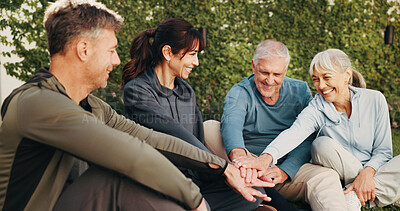 Buy stock photo Outdoor, people and hands with huddle for fitness, support and celebration together. Park, retirement and mature friends with stack for solidarity, exercise goal or motivation with wellness team