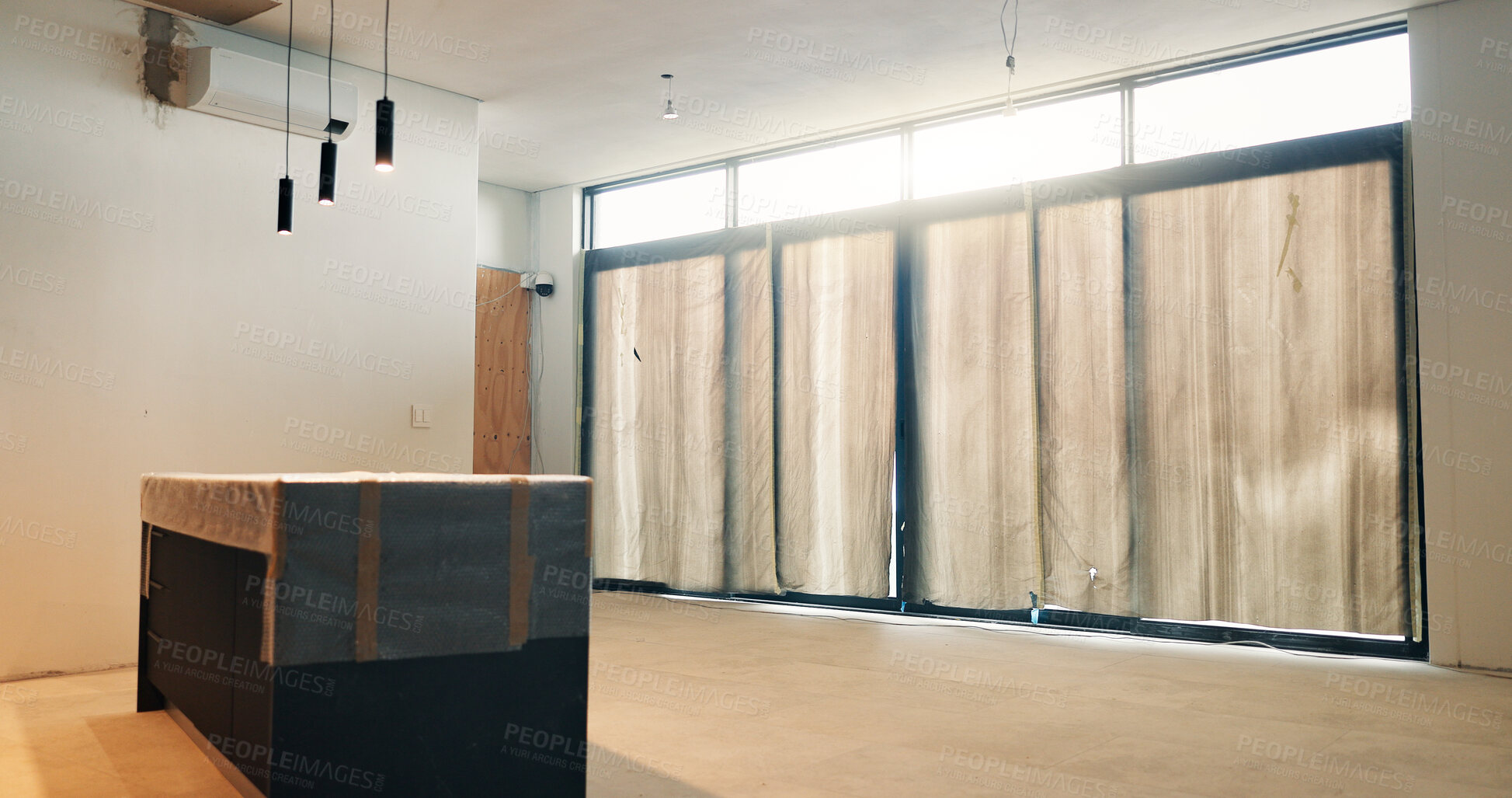 Buy stock photo Empty, room and real estate remodeling with cover for new home, modern finish and property upgrade. Interior design, renovation project and sheeting for house makeover, refurbishment and restoration