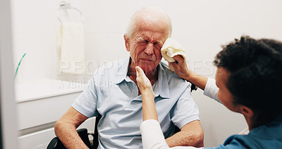 Buy stock photo Caregiver, helping and old man in bathroom for skincare, washing face and assistance for hygiene. Nurse, house and senior person with disability, facial cleaning and washcloth for morning routine