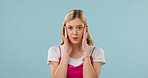 Portrait, woman and student in studio with stress, scholarship or academic pressure for education. Mockup space, person and concern for learning, poor grades and fail entrance exam on blue background