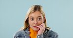 Nervous, woman and student in studio with stress, exam anxiety and academic pressure for education. Mockup space, person or biting nails with concern, poor grades and fail semester on blue background