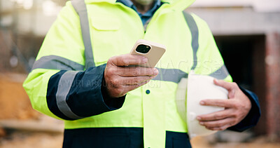 Buy stock photo Civil engineer, message and hands with phone on construction site, chat or communication on website. Architect, outdoor and person with mobile, texting and property development update on social media