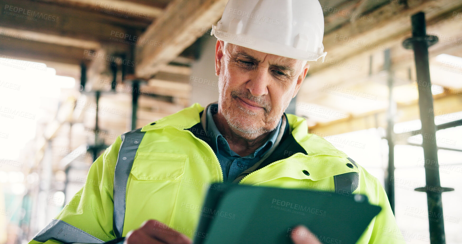 Buy stock photo Architect, man and smile on construction site with tablet, check building design and project management. Happy, mature person and research with tech for architecture, infrastructure and planning.