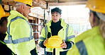 People, helmet and team on construction site for discussion, compliance update or property development. Civil engineer, group and hardhat on worksite for safety protocol, planning or project feedback