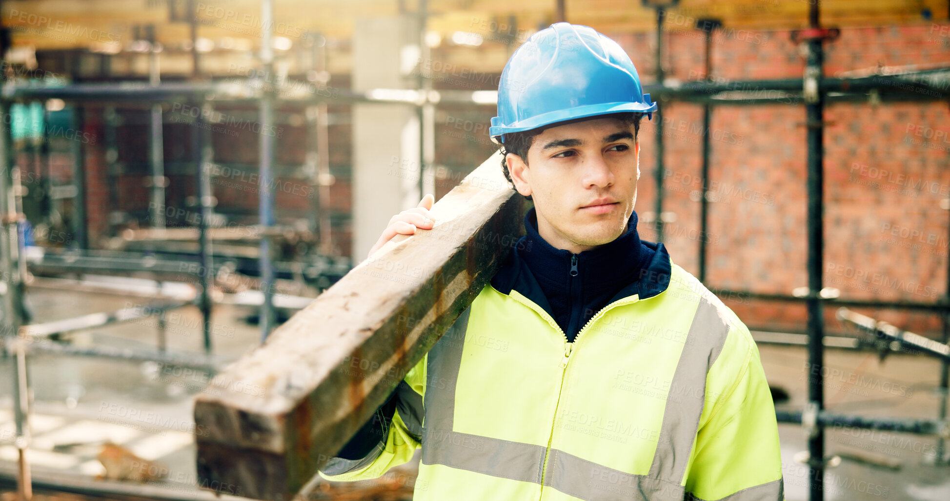 Buy stock photo Think, man and wood on construction site for renovation, scaffolding and building mindset with lumber. Person, laborer and plank with vision for remodeling project, infrastructure upgrade and helmet